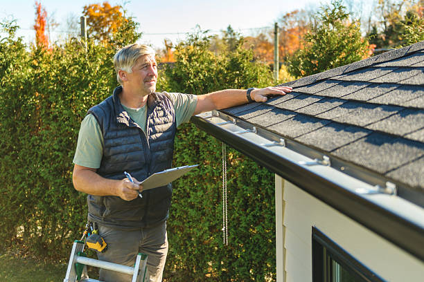 Professional Hail Damage Roof Repair technician working in Lake City, TN